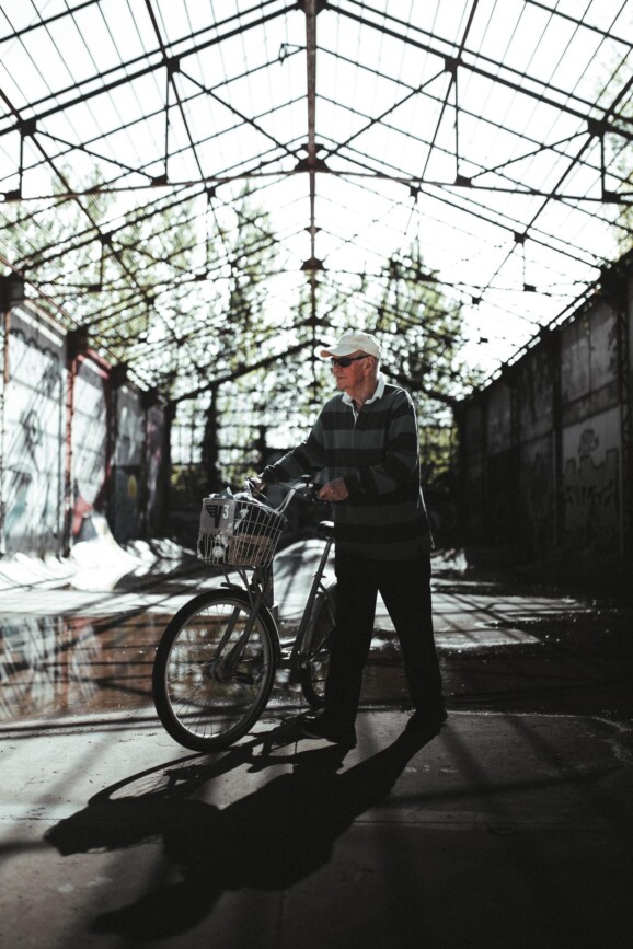 A man pushes his bike.